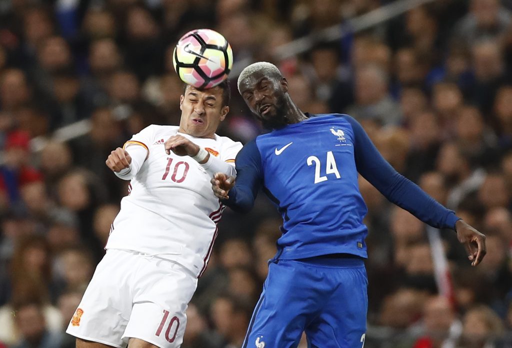Spain's Thiago Alcantara in action with France's Tiemoue Bakayoko.