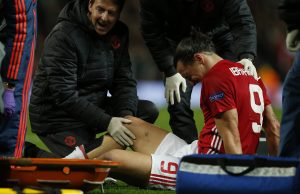 Manchester United's Zlatan Ibrahimovic receives medical attention after sustaining an injury.