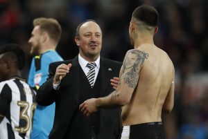 Newcastle manager Rafael Benitez celebrates being promoted to the premier league with Aleksandar Mitrovic.