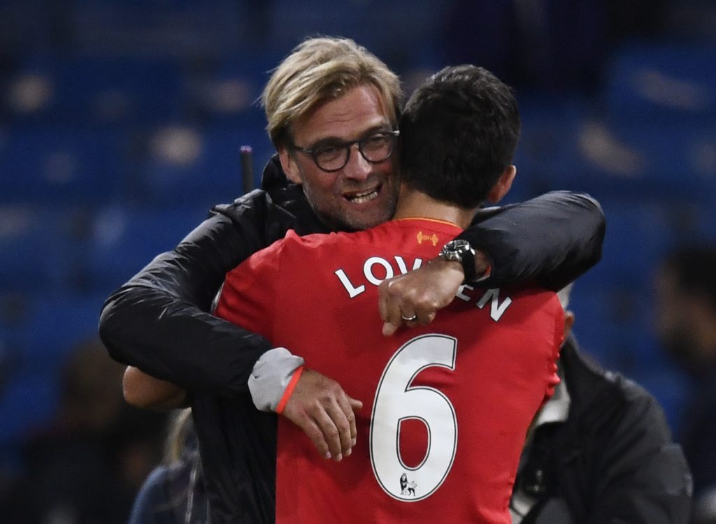 Liverpool manager Jurgen Klopp celebrates with Dejan Lovren after the game.