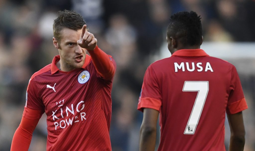 Leicester City's Jamie Vardy talks to Ahmed Musa.