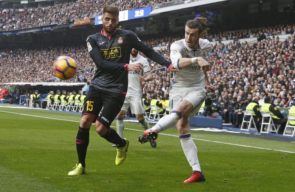 Real Madrid's Gareth Bale in action against Espanyol's David Lopez.