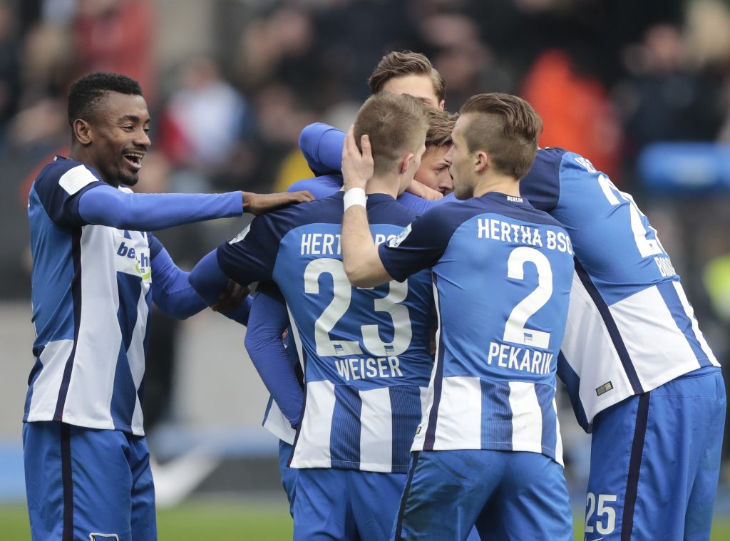 Hertha Berlin's Marvin Plattenhardt celebrates after scoring a goal with his teammates.