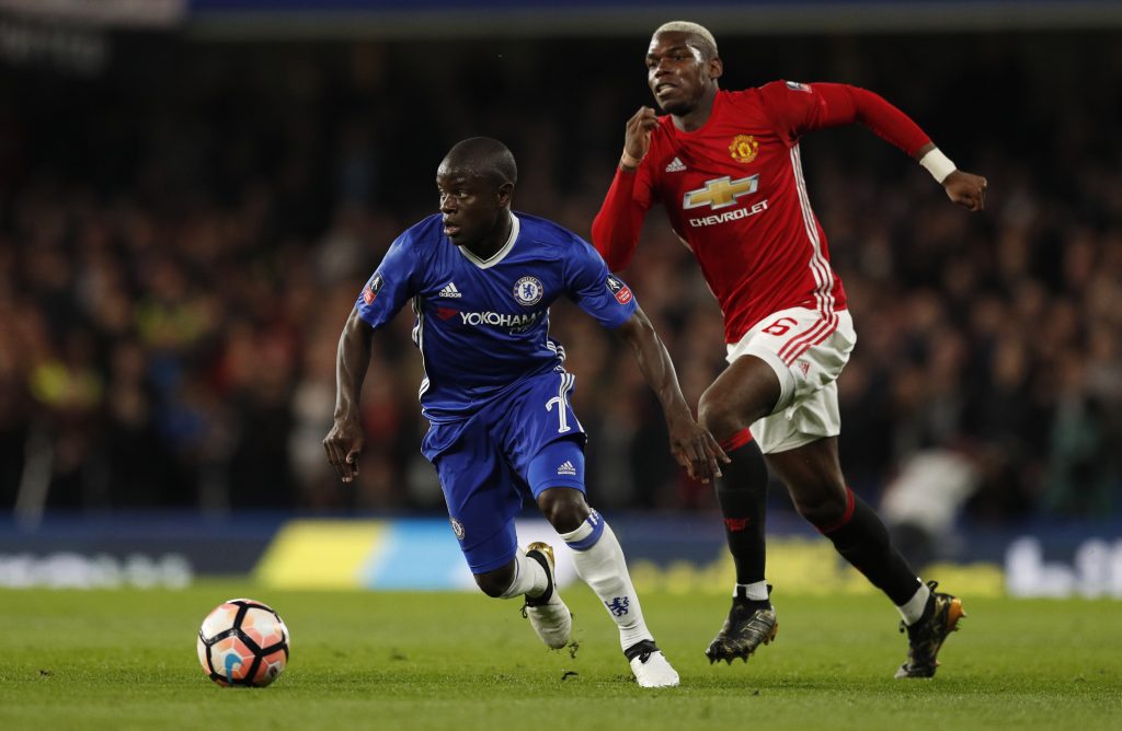 Manchester United's Paul Pogba in action with Chelsea's N'Golo Kante.