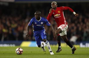 Manchester United's Paul Pogba in action with Chelsea's N'Golo Kante.