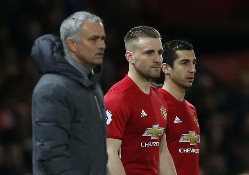 Luke Shaw and Henrikh Mkhitaryan wait to come on as substitutes.