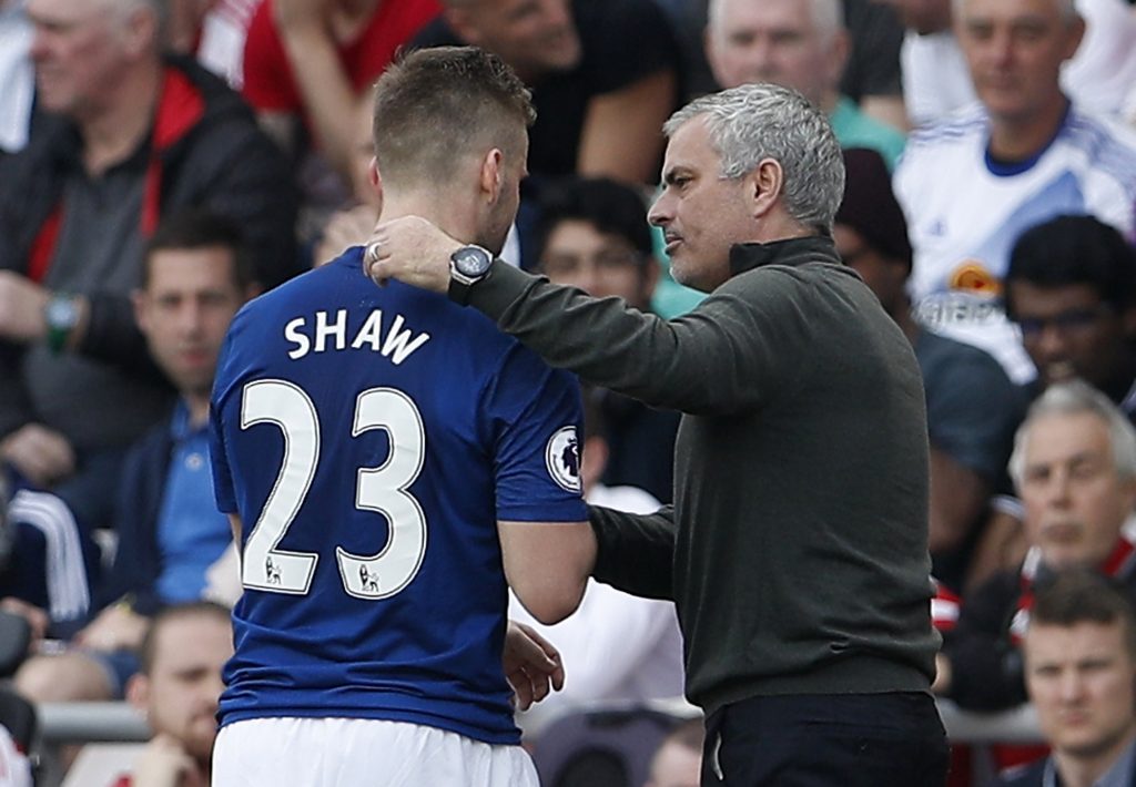 Luke Shaw is congratulated by manager Jose Mourinho as he is substituted.