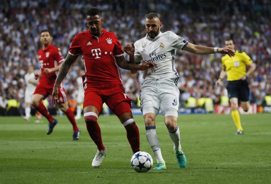 Real Madrid's Karim Benzema in action with Bayern Munich's Jerome Boateng.