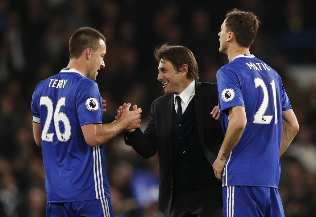 Chelsea manager Antonio Conte celebrates after the match with John Terry and Nemanja Matic.