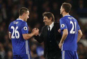 Chelsea manager Antonio Conte celebrates after the match with John Terry and Nemanja Matic.