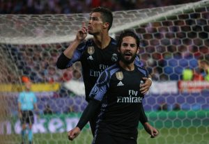Real Madrid's Isco celebrates scoring their first goal with Cristiano Ronaldo.