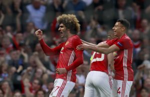 Marouane Fellaini celebrates scoring their first goal with Jesse Lingard.