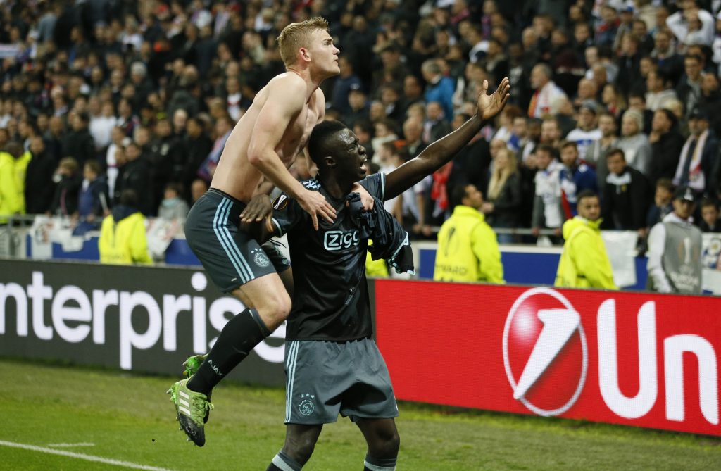Ajax's Matthijs de Ligt and Davinson Sanchez celebrate after the match.