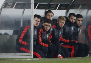 Manchester United's William Keane, Regan Poole, Joe Riley and James Weir on the bench.