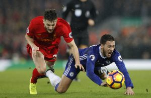 Eden Hazard in action with Liverpool's Adam Lallana.