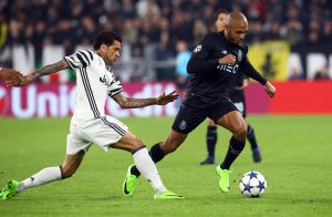 Juventus' Dani Alves in action with FC Porto's Yacine Brahimi.