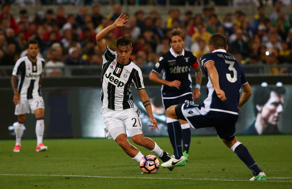 Juventus Paulo Dybala in action with Lazios Stefan de Vrij.