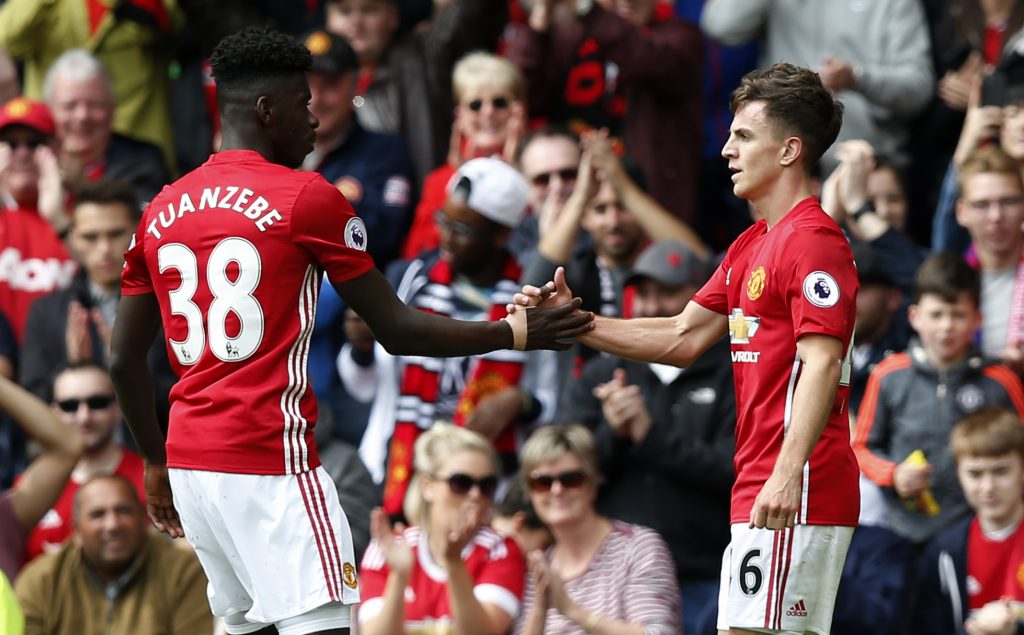 Manchester United's Josh Harrop celebrates scoring their first goal with Axel Tuanzebe.