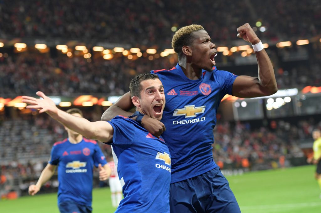 Henrikh Mkhitaryan (L) of Manchester United celebrates a goal with teammate Paul Pogba.