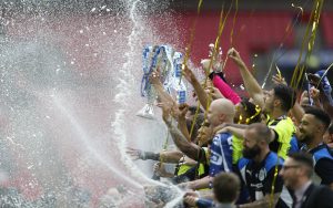 Huddersfield Town celebrate with the trophy after winning the Sky Bet Championship Play-Off Final and getting promoted to the Premier League.
