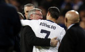 Sir Alex Ferguson (L) speaks to Cristiano Ronaldo.