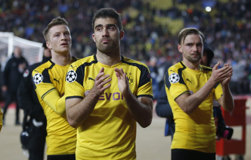 Borussia Dortmund's Sokratis Papastathopoulos applauds fans after the match.