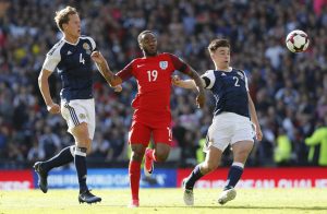 England's Raheem Sterling in action with Scotland's Kieran Tierney and Christophe Berra.