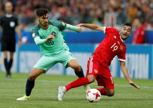 Portugals Andre Gomes in action with Russias Aleksandr Samedov.