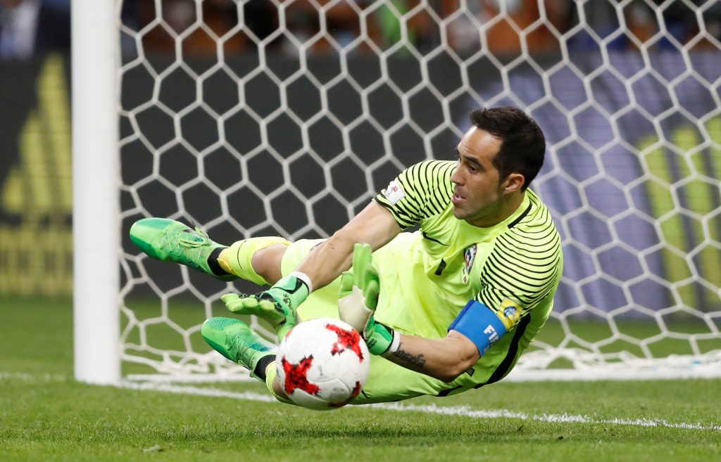 Chiles Claudio Bravo saves from Portugals Nani to win the penalty shootout.