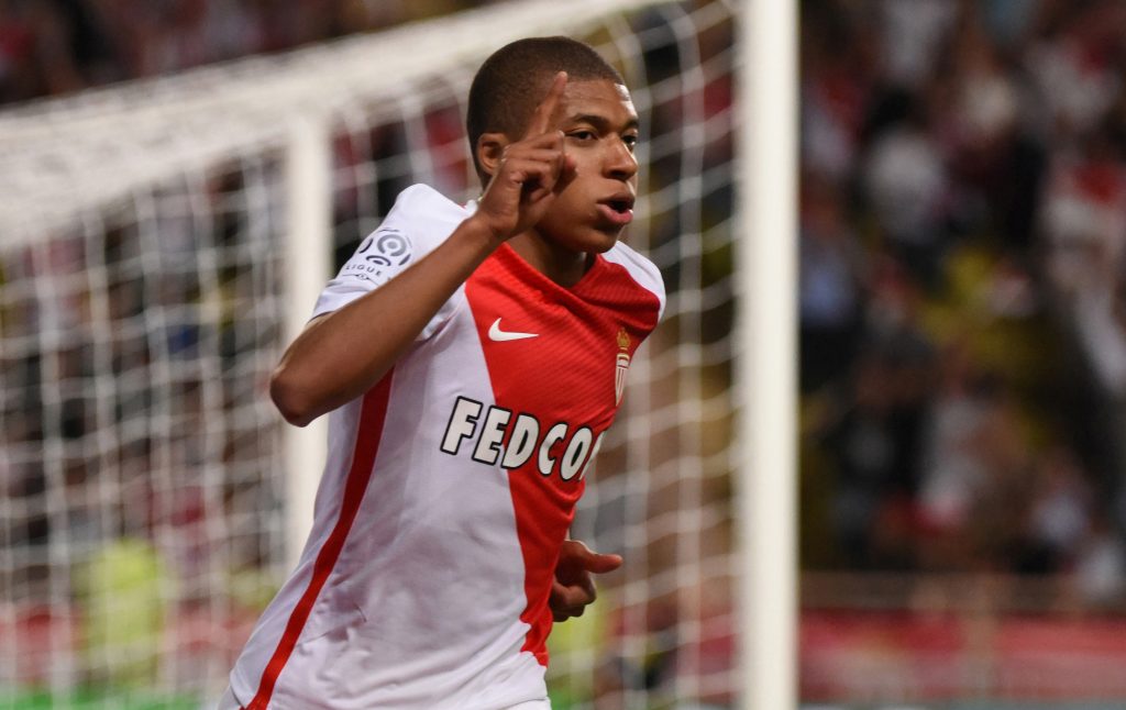 Monacos Kylian Mbappe celebrates scoring their first goal.