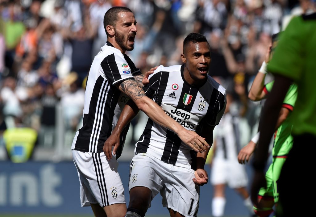 Juventus Alex Sandro celebrates scoring their third goal with Leonardo Bonucci.