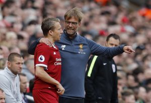 Liverpool manager Jurgen Klopp speaks to Lucas Leiva as he prepares to come on as a substitute.