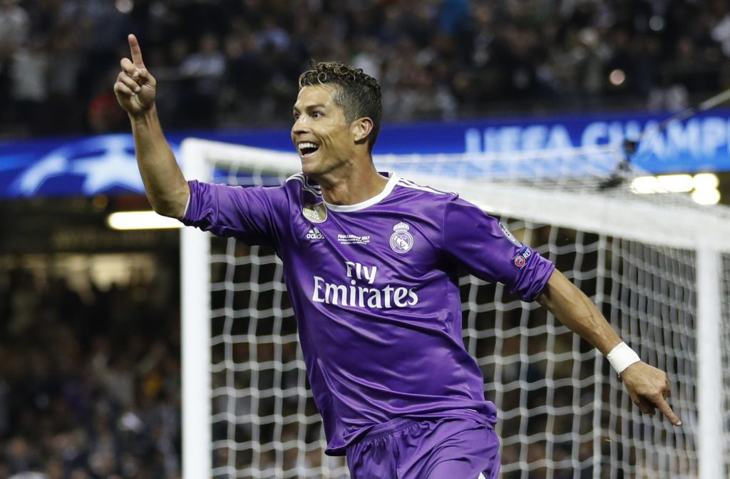 Real Madrid's Cristiano Ronaldo celebrates scoring their third goal.