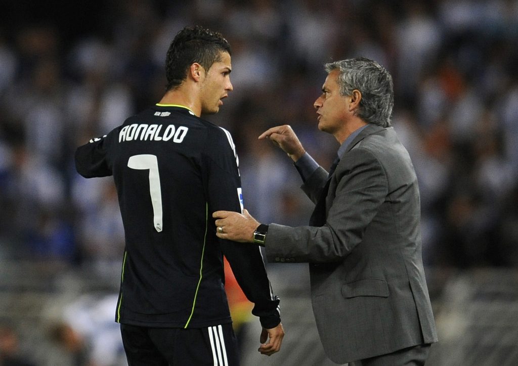 Jose Mourinho gives instructions to Cristiano Ronaldo.