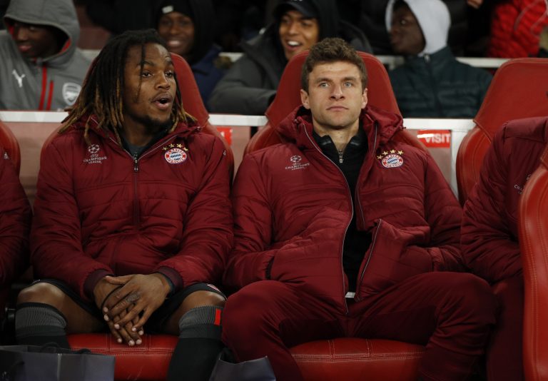 Bayern Munich's Renato Sanches and Thomas Muller on the substitutes bench.