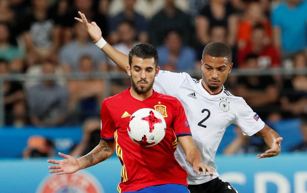 Spain's Dani Ceballos and Germany's Jeremy Toljan in action.