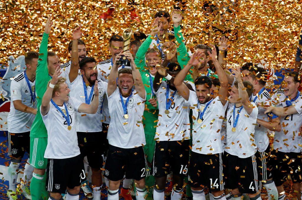 Germanys Shkodran Mustafi celebrates with the trophy and team mates after winning the FIFA Confederations Cup.