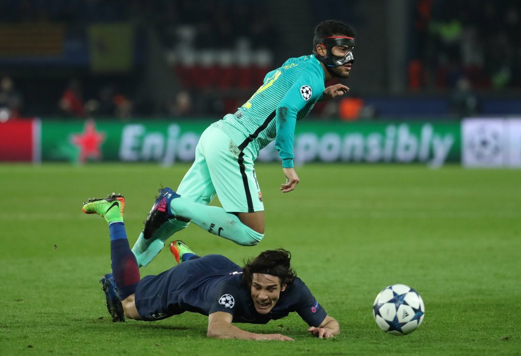 Paris Saint-Germain's Edinson Cavani in action with Barcelona's Rafinha.