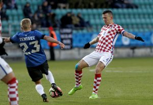 Ivan Perisic of Croatia in action with Taijo Teniste of Estonia.