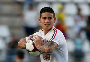 Colombia's James Rodriguez warms up before the match.