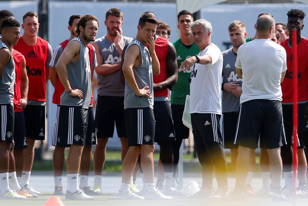 Manchester United's Jose Mourinho (C-R) directs training.