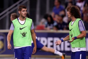 Chelsea's Alvaro Morata warms up with David Luiz.