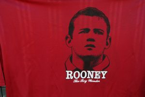 T-shirts showing the face of England striker Wayne Rooney.