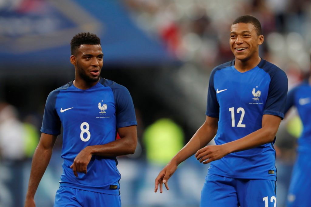 France's Kylian Mbappe celebrates with Thomas Lemar at the end of the match.