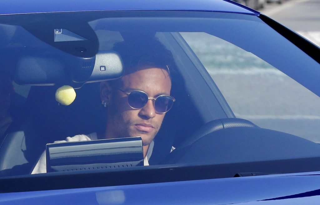 Neymar drives to arrive to Joan Gamper training camp near Barcelona.