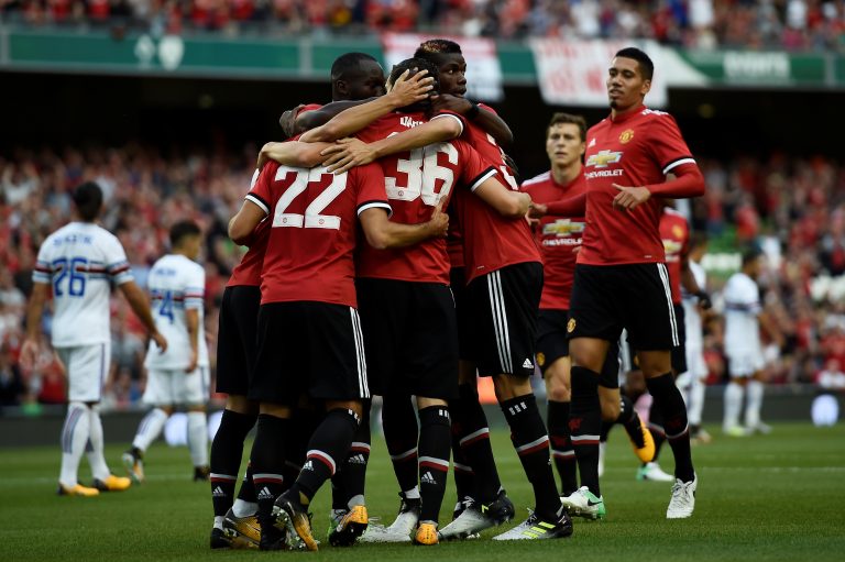 Manchester United's Henrikh Mkhitaryan celebrates scoring their first goal with team mates.