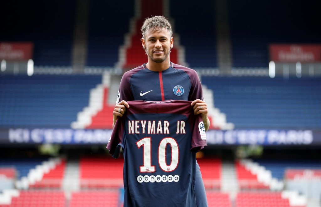 New Paris Saint-Germain signing Neymar Jr poses with the club shirt.