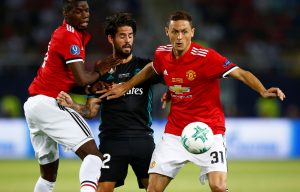Isco in action with Nemanja Matic and Paul Pogba.