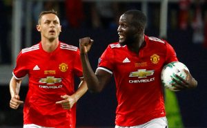Manchester United's Romelu Lukaku celebrates scoring their first goal with Nemanja Matic.
