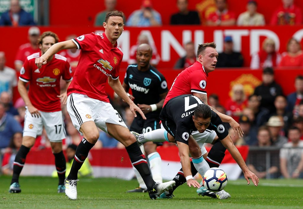 Javier Hernandez in action with Nemanja Matic and Phil Jones.
